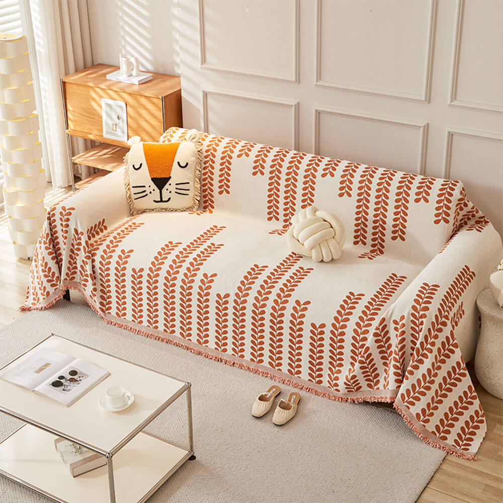 Pokrowiec na kanapę z motywem liści i frędzlami – elegancja i komfort